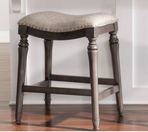 lot 4633 image: Copper Grove Barmstedt Grey Counter Stool with Saddle Seat - Retail$101.99