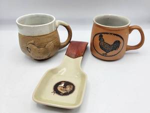 lot 5339 image: (2) Pottery Rooster Mugs  Pottery Spoon Rest