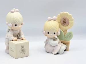 lot 5344 image: (2) Precious Moments Figurines - A GROWING LOVE  SHARING IS UNIVERSAL