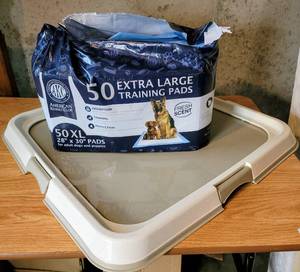 lot 5459 image: Dog or Puppy Training Pee Pad Holder  Bag of 28 x 30 Pads