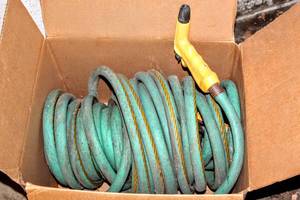 lot 5299 image: Garden Hose and Attachments