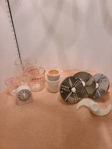 lot 1345 image: Glass measuring cups, Food processor parts, and plastic timer