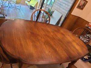 lot 1384 image: Oak Table 66 x 41 with 4 chairs and 2 leaves 15 inches each
