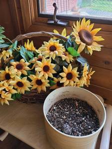lot 1387 image: A plastic flower pot 8 wide and a basket of artificial sunflowers