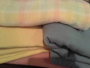 lot 1566 image: 4 Blankets. 1 Pink, 1 Blue, 1 Yellow and 1 Multi Colored