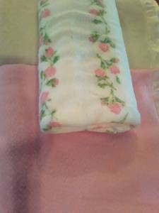 lot 1567 image: 3 Blankets. 1 Cream Colored, 1 Pink and the Other White with Pink Flowers
