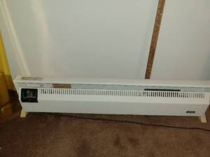 lot 1647 image: INTERTHERM. Heater. Sits on Floor. Approximately 40 inches long and 9 inches tall