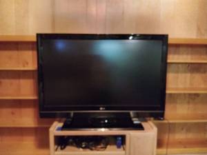 lot 2009 image: 42 LG Flat Screen Color TV with 2 Remotes