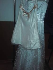 lot 1524 image: 2 Prom Dresses White one is Size 34. Creamed Colored is Size 7