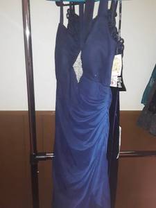 lot 1528 image: 2 More Prom Dresses. Sizes 4 and 6. (still have tags on them).