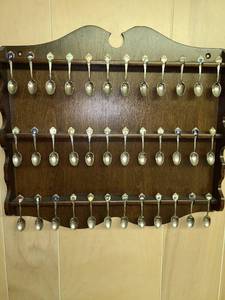 lot 2049 image: Thirty six state souvenir spoons in wood rack