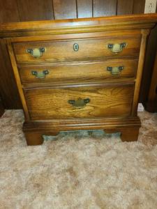 lot 2201 image: Two drawer nightstand. 26X27X17. Matches dresser in Lot 2200.