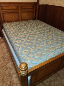 lot 2202 image: Queen size bed frame matches dresser and nightstand in lots 2200 and 2201. Includes mattress and box spring.