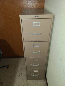 lot 2218 image: Four drawer letter size file cabinet 52 by 15 by 27 including drawer full of maps and tourism brochures