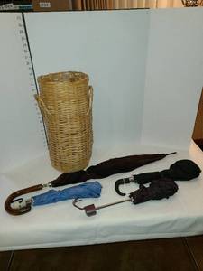 lot 1211 image: Four umbrellas and a basket