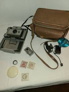 lot 1219 image: Polaroid camera with case, etc.