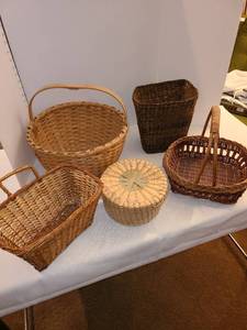lot 1235 image: Five baskets including one with a lid