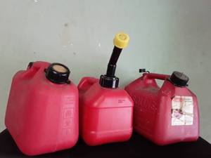 lot 3002 image: 3) Gas Cans 1.25 gallon, 1gallon 4 oz, 1.5 gallon