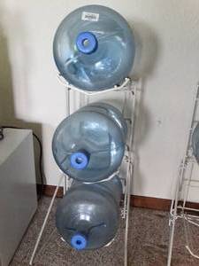 lot 24003 image: Three 5 Gallon Bottles and Metal Storage Rack