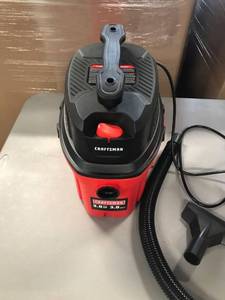 lot 1112 image: craftsman 3 gallon wet dry vac with attachments.