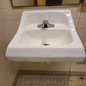 lot 21058 image: Kohler ceramic sink with Sloan motion sensor faucet