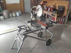 lot 105 image: Rigid MS-UV Radial Arm Saw on Rolling Stand