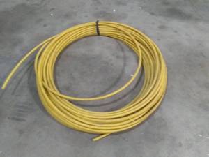 lot 122 image: Large Roll of Yellow pipe Gas Line