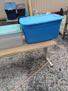 lot 415 image: 3 totes one clear green top two blues one blue one has a broken top