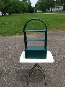 lot 428 image: green wicker hanging shelf with door 19 in wide 9 inches deep and 33 in tall
