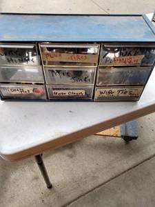 lot 483 image: plastic parts bin and contents