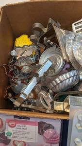 lot 1493 image: box of cookie tins and candy molds