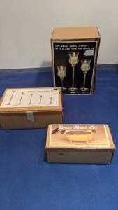 lot 1515 image: brass bathtub 5-piece brass candle holder set and three-piece brass candle holder stick with glass cup and candles new in boxes