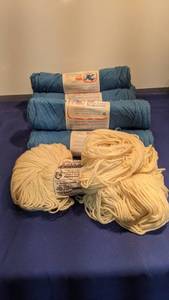 lot 1557 image: six skeins a blue yarn and one cream color