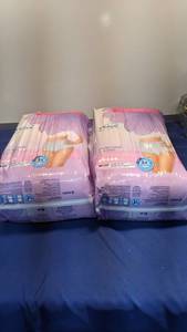 lot 1575 image: two packages of Tena underwear size small medium 29 to 40 in