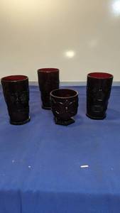 lot 1588 image: Three Ruby glasses and a juice glass