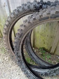 lot 2069 image: Two Michelin 9090-21 and one Bridgestone 80100-21 near new