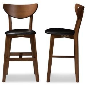 lot 1057 image: Baxton Studio Latina Black Faux Leather and Medium Brown Wood 2-Piece Counter Stool Set -- MSRP $153.89