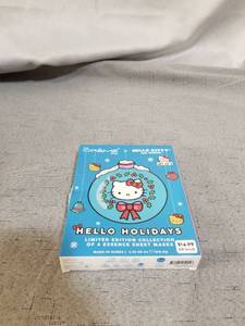 lot 17262 image: The Creme Shop Hello Kitty Set Of 4 Holiday Essence Sheet Masks - In Box