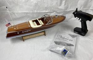 lot 9749 image: Remote Control Boat - Volere 22 w stand, transmitter, booklet and original stickers and boat wax - Excellent Visual Condition - Owner says they couldnt operate it.