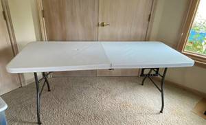 lot 9776 image: Folding White 6 foot table w handle - see pics