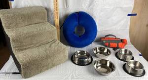 lot 9833 image: Lot of Doggie Supplies - Small Dog life Vest, Food and Water Bowls and Steps - Large Dog Inflatable Neck Pet Link (replaces cone)