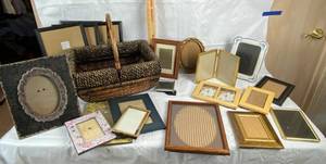 lot 9892 image: Nice Decorative basket with a lot of picture frames of various styles and sizes - basket is high quality