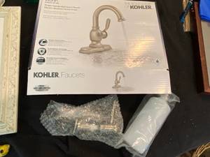 lot 9893 image: Kohler Brushed Nickel Finish Single Handle bathroom Faucet - Appears new in original packaging - w in counter soap dispenser - WOW