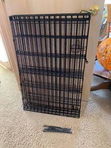 lot 9917 image: Portable Folding Wire Dog Pen - 8 panels connected - Each panel is 36 tall x 24 wide w tie down stakes and chain hook - Excellent Condition, nice and clean
