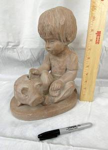 lot 9651 image: Large Sculpture Figuring of Child Adding Money to Piggy Bank - Almost 1 foot tall