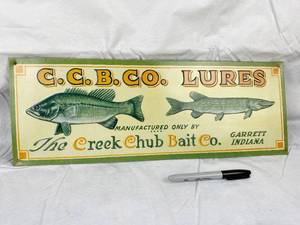 lot 9674 image: Metal Embossed Creek Chub Bait Co. Sign - 18.5 x 6.5