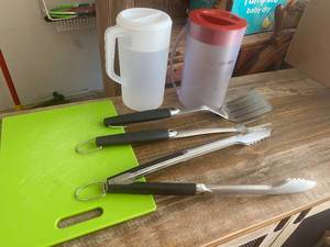 lot 9722 image: Cookout Bundle - Nice Metal Spatula, Tongs, Fork, Pitchers and a Cutting Board