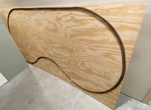lot 9729 image: 1 Sheet of Plywood - 8ft x 4ft - w train track attached