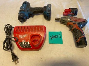 lot 3352 image: Milwaukee Impact Gun Works w Charger and Extra Batteries and a Hercules Impact Gun works (no charger)