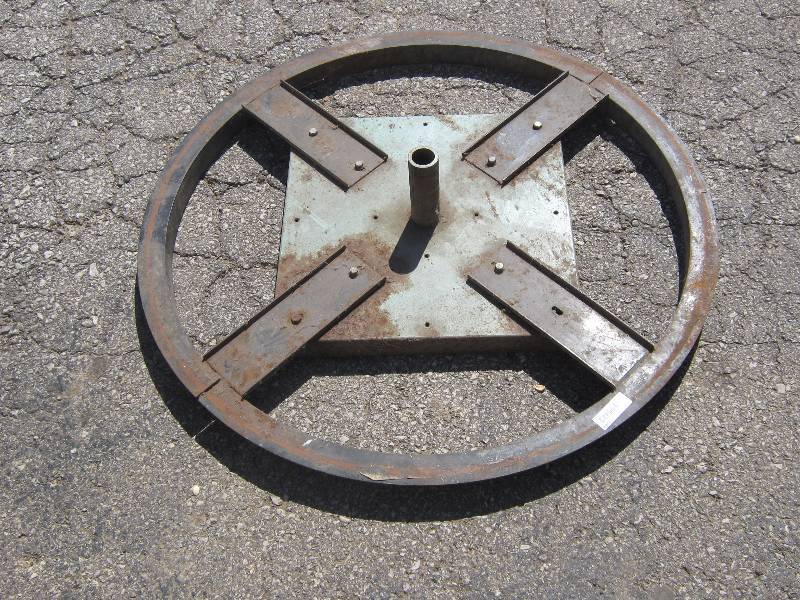 lot 7049 image: Large heavy metal market umbrella stand 36 diameter 1-38 hole for umbrella weighs over 30 lbs.